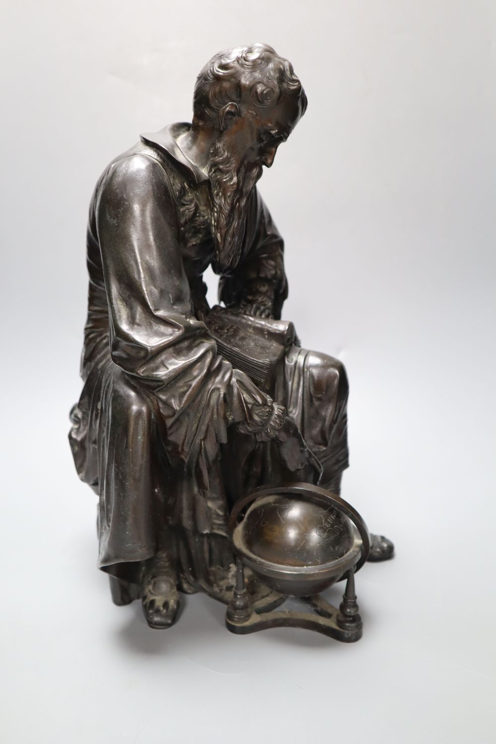 Jean Gout. A bronze model of a scholar painting to a globe, height 34cm